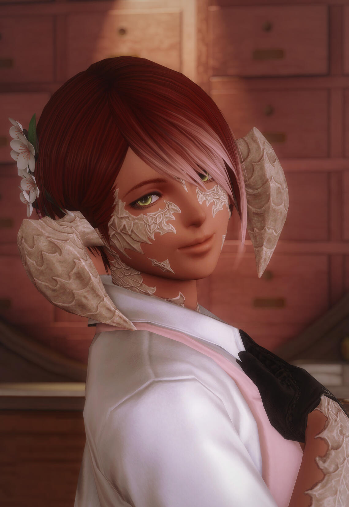 A smiling auri woman with flowers in her hair.